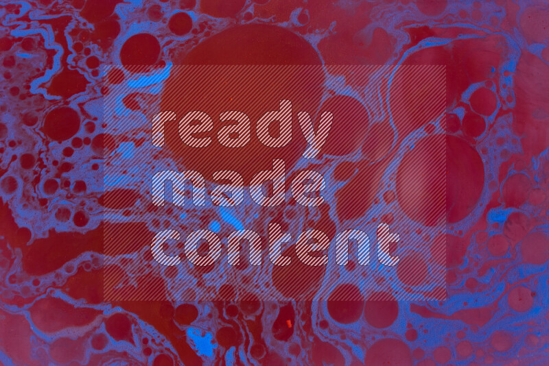 The image depicts a marbling effect with swirling patterns of red and blue