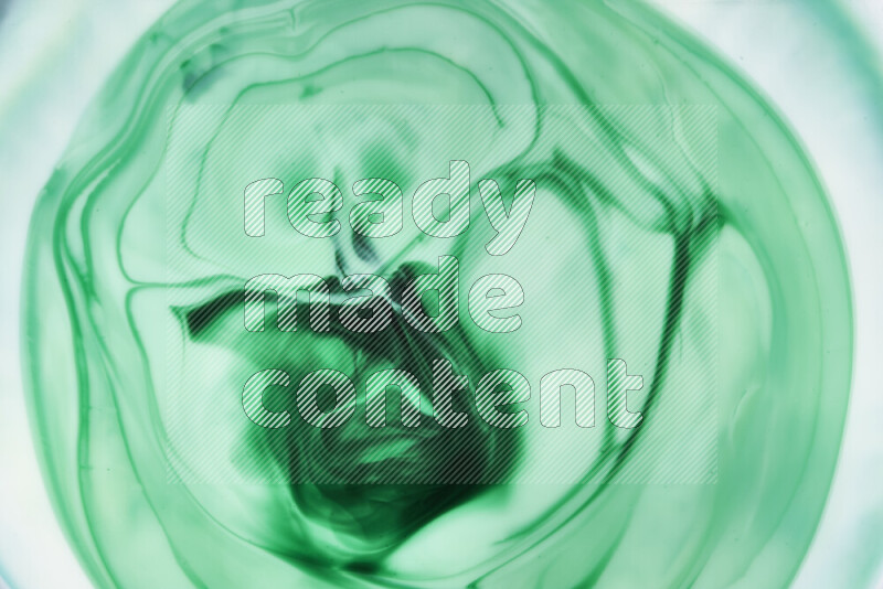 A close-up of abstract swirling patterns in green gradients