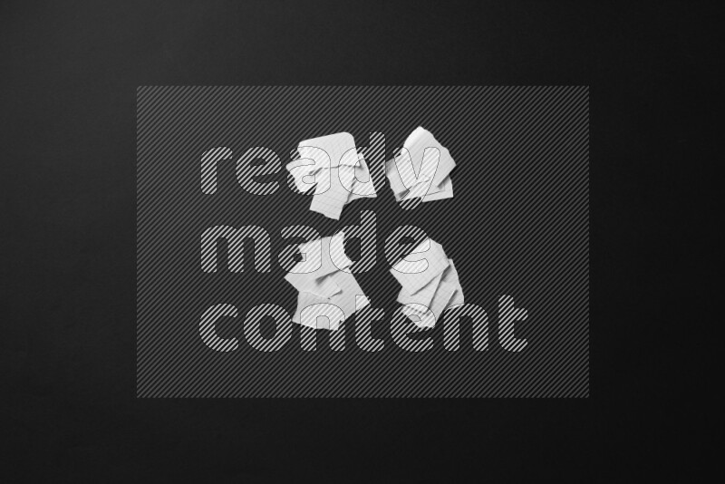 Ripped notebook sheet on black background