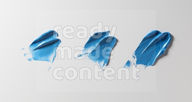 Blue painting knife strokes on white background