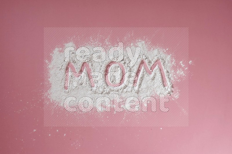 A word written with powder on pink background
