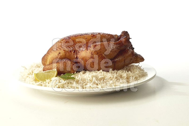 white  basmati Rice with  whole roasted chicken  on a white rounded plate direct on white background