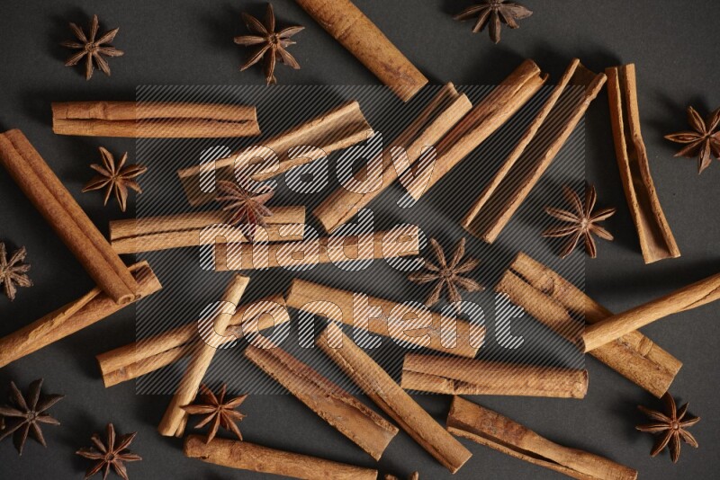 Cinnamon sticks and star anise on black background