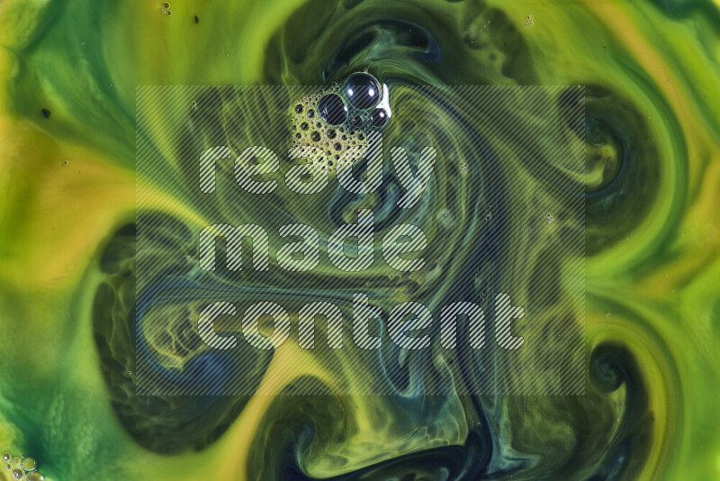 A close-up of abstract swirling patterns in orange and green