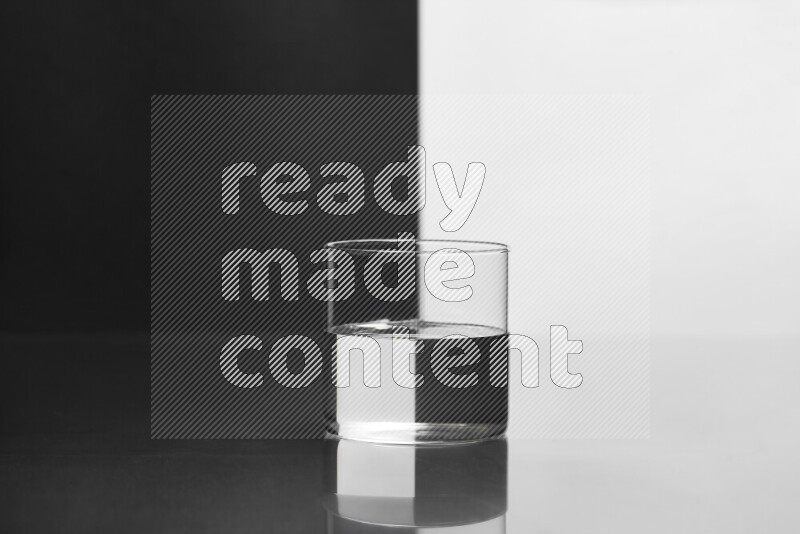 The image features a clear glassware filled with water, set against white and black background