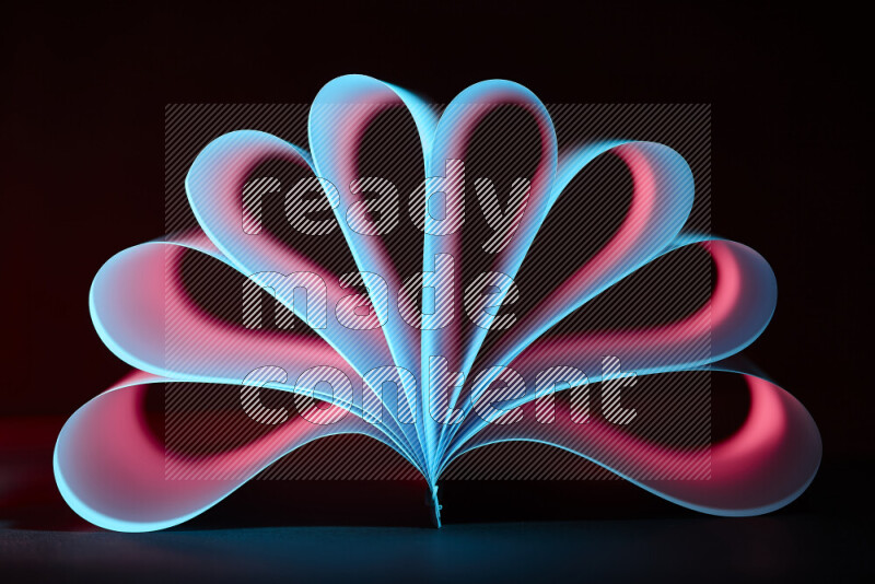 An abstract art piece displaying smooth curves in blue and red gradients created by colored light