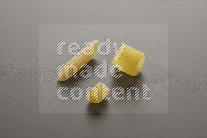 Different pasta types on grey background