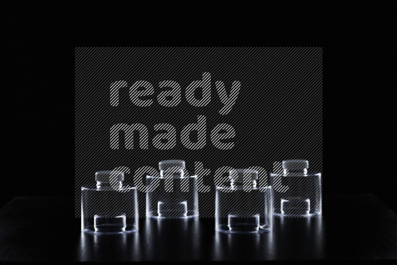 Glassware with rim light against black background