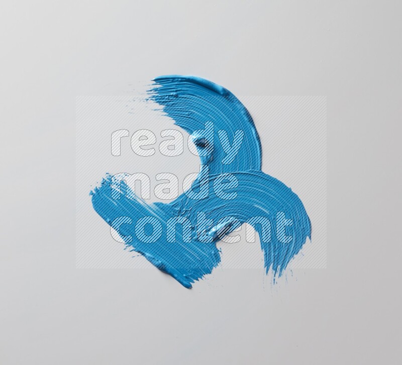 Multi blue curved brush strokes shaped into different shapes on a white background