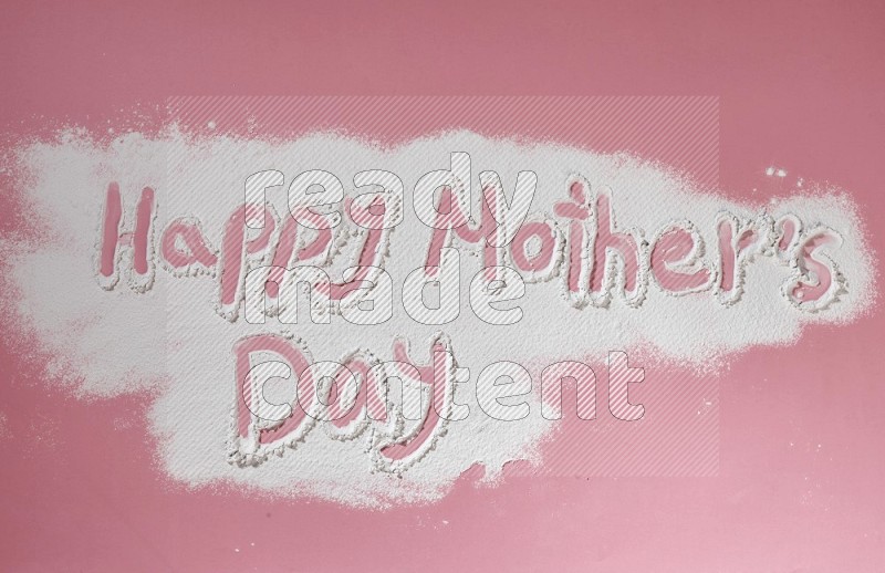 A sentence written with powder on pink background