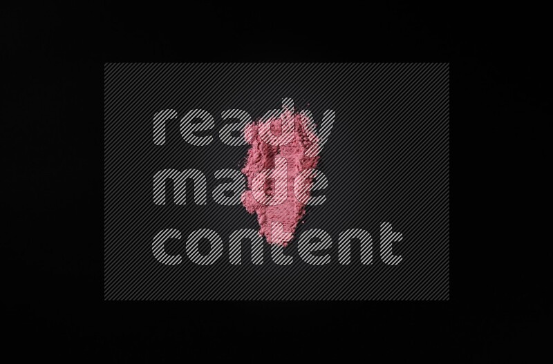Red powder strokes on black background