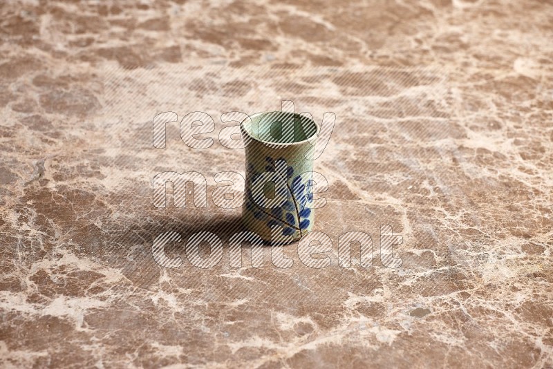 Pottery Cup on Beige Marble Flooring