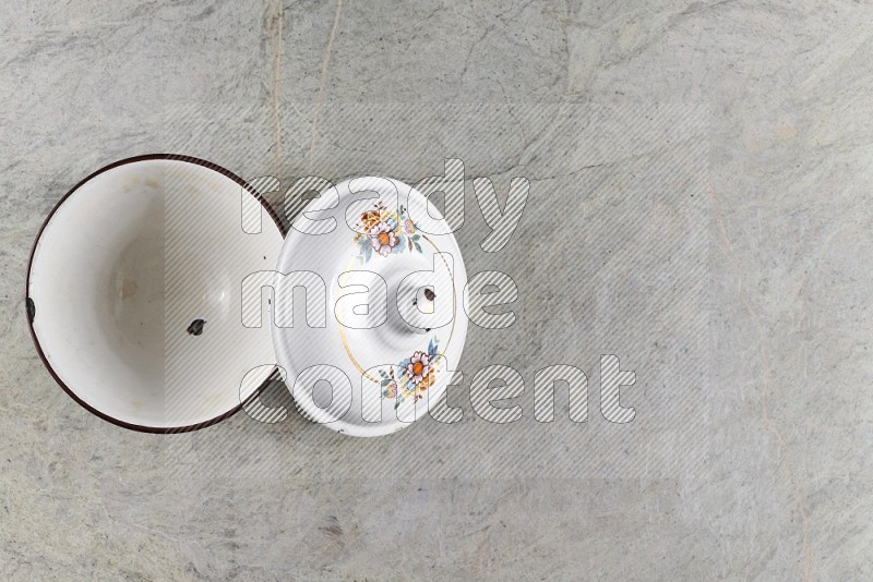 Top View Shot Of A Vintage Pot On Grey Marble Flooring