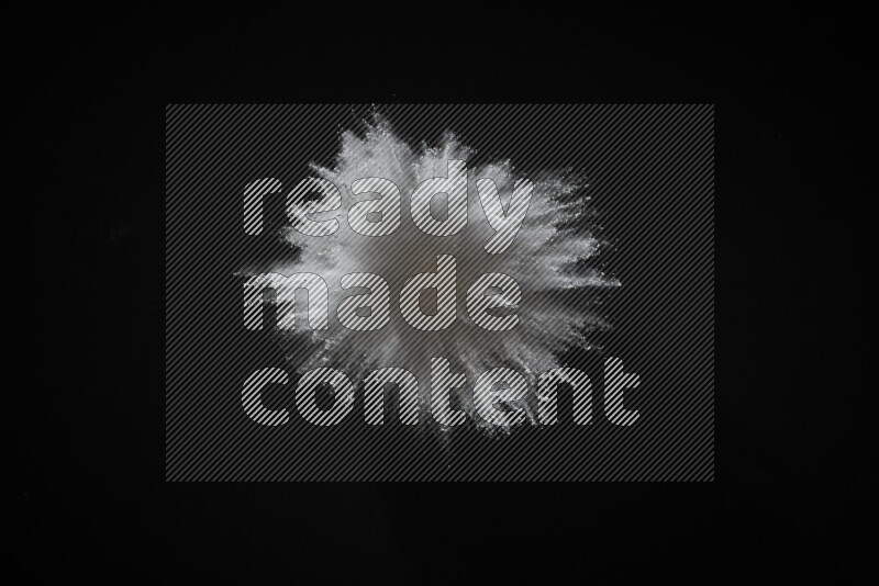 White powder explosion on black background