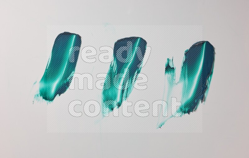 Turquoise painting knife strokes on white background