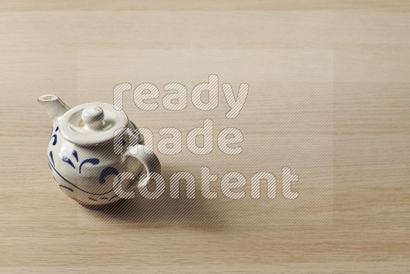 Pottery Teapot on Oak Wooden Flooring, 45 degrees