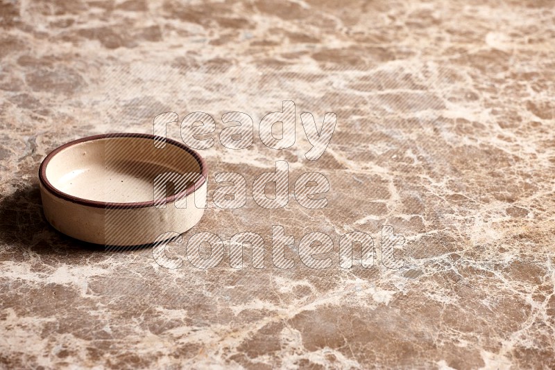 Beige Pottery Oven Plate on Beige Marble Flooring, 45 degrees