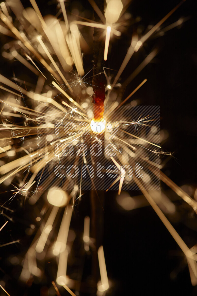 A close-up image of sparkler candle isolated on black background