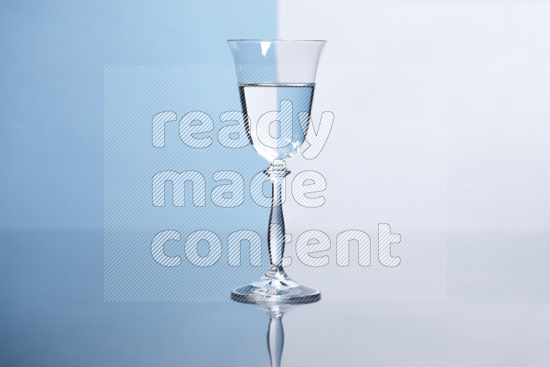 The image features a clear glassware filled with water, set against white and light blue background