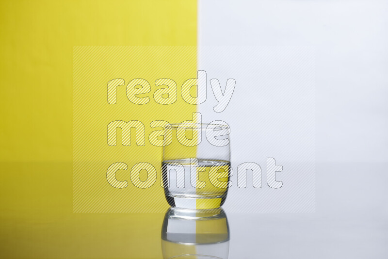 The image features a clear glassware filled with water, set against white and yellow background