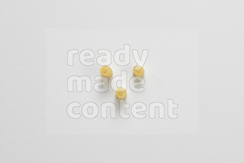 Small rings pasta on white background