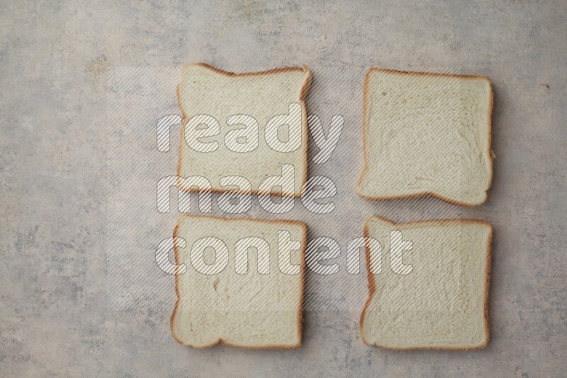 White Toast slices on alight blue textured background