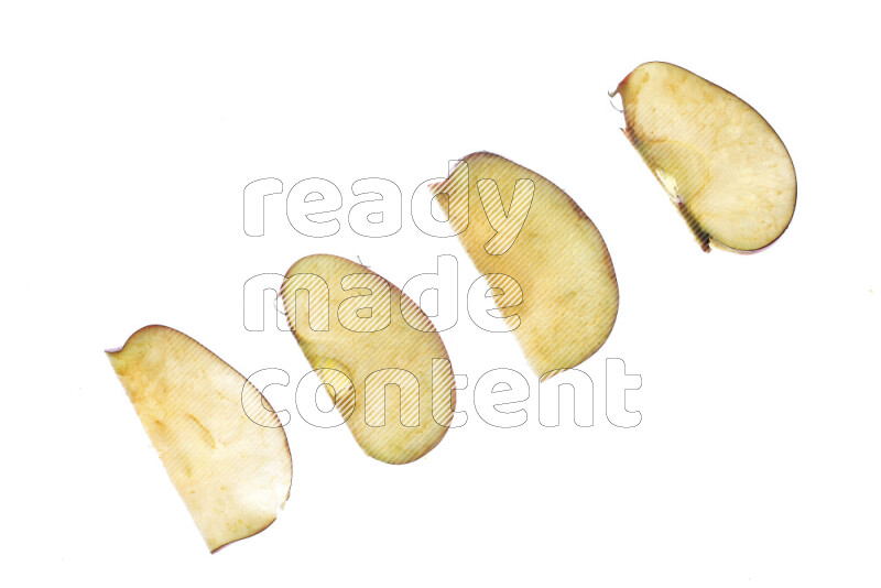 Apple slices on illuminated white background