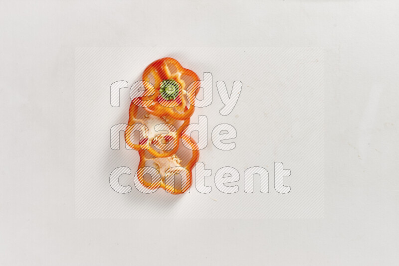 Red bell pepper slices on white background