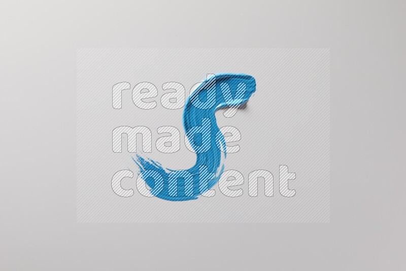 A single blue S curved brush stroke on a white background