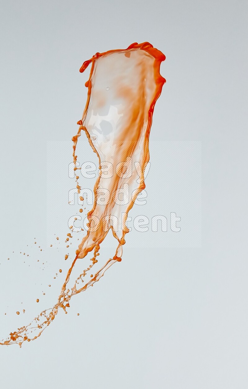 Orange liquid splash and drops on white background