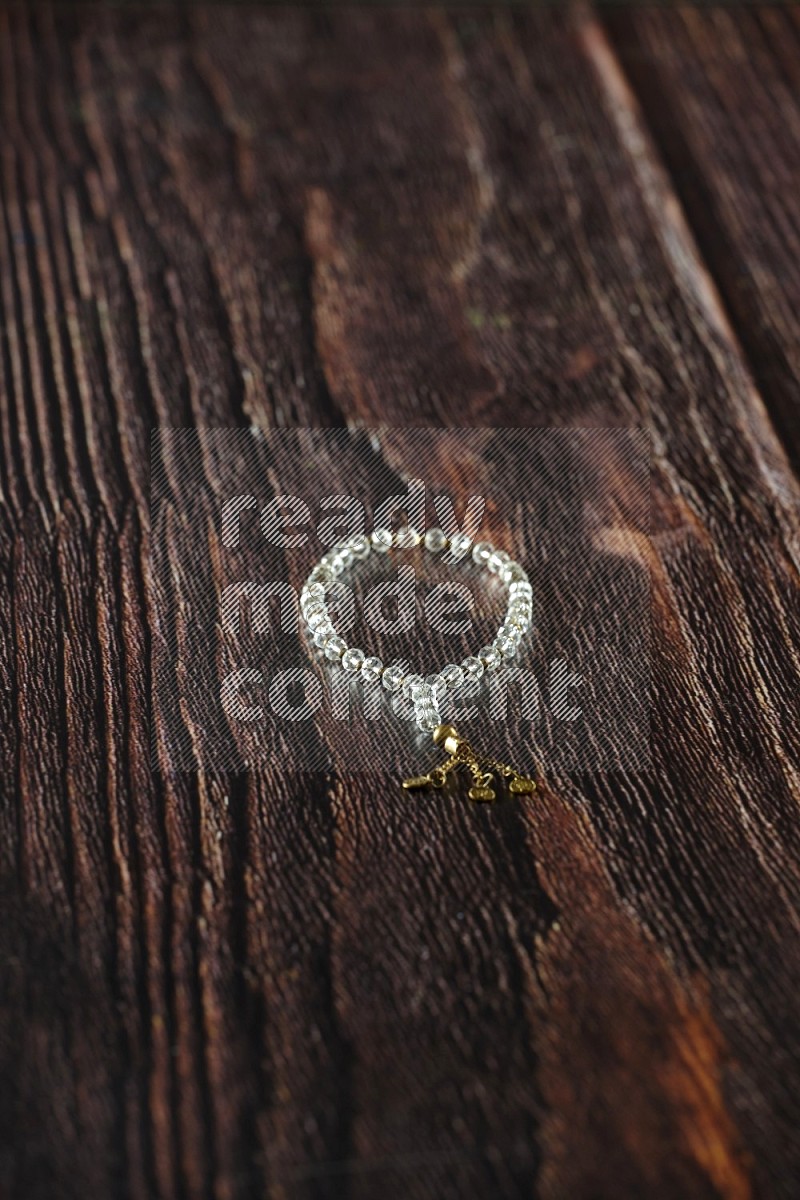 Prayer beads on wooden background