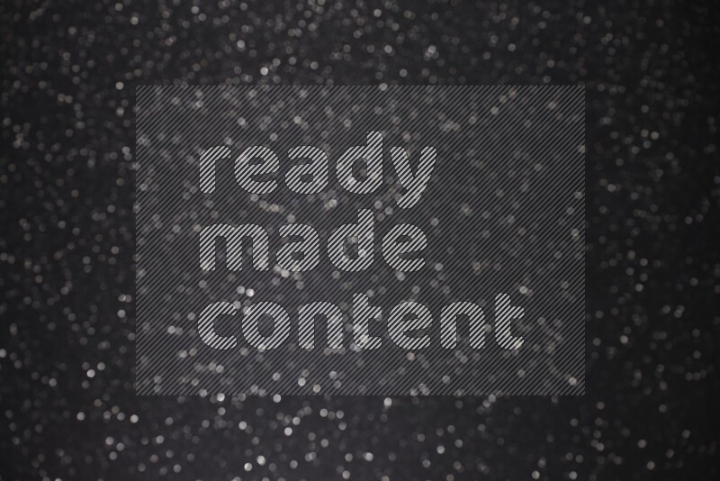 Black glittery bokeh background