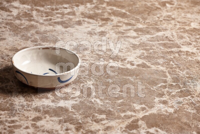 Multicolored Pottery Bowl on Beige Marble Flooring