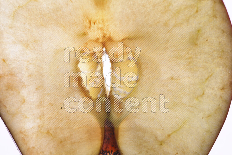 Apple slices on illuminated white background