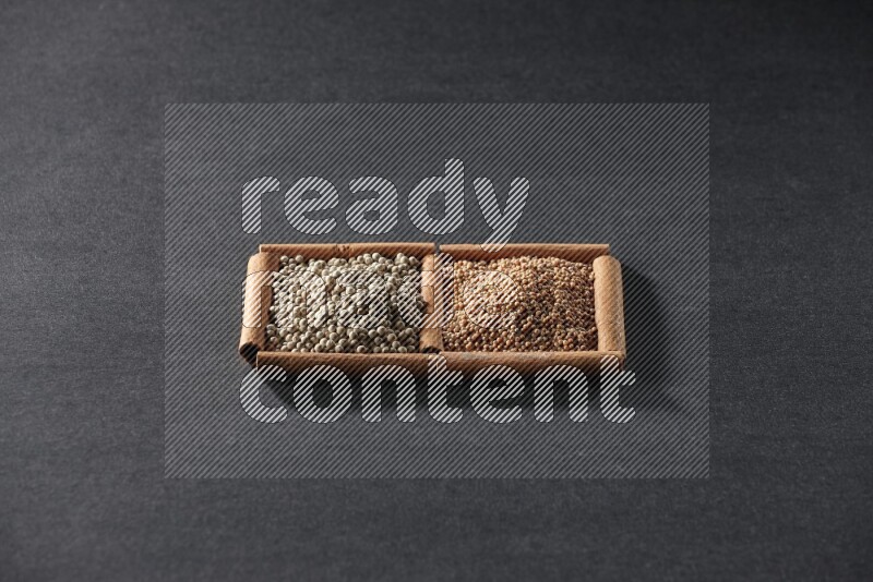 2 squares of cinnamon sticks full of mustard seeds and white peppers on black flooring