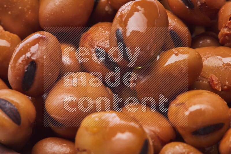 Close up shot of cooked fava beans (foul) on white background