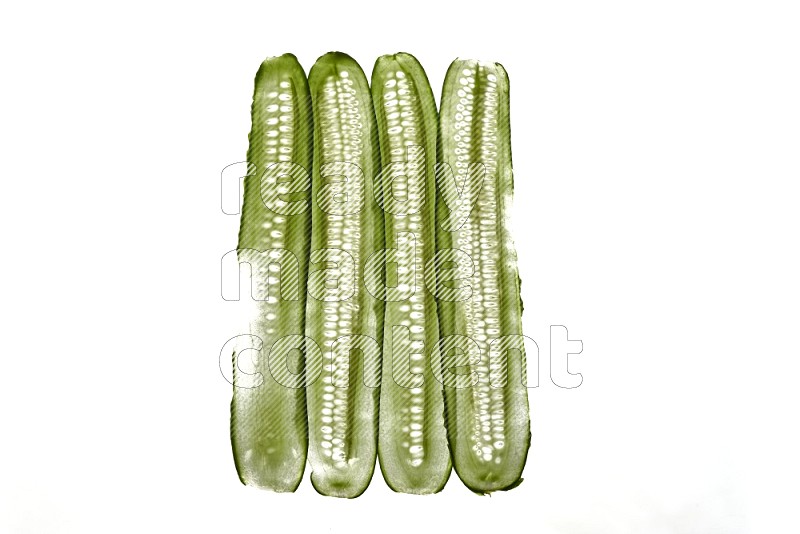 Cucumber slices on illuminated white background