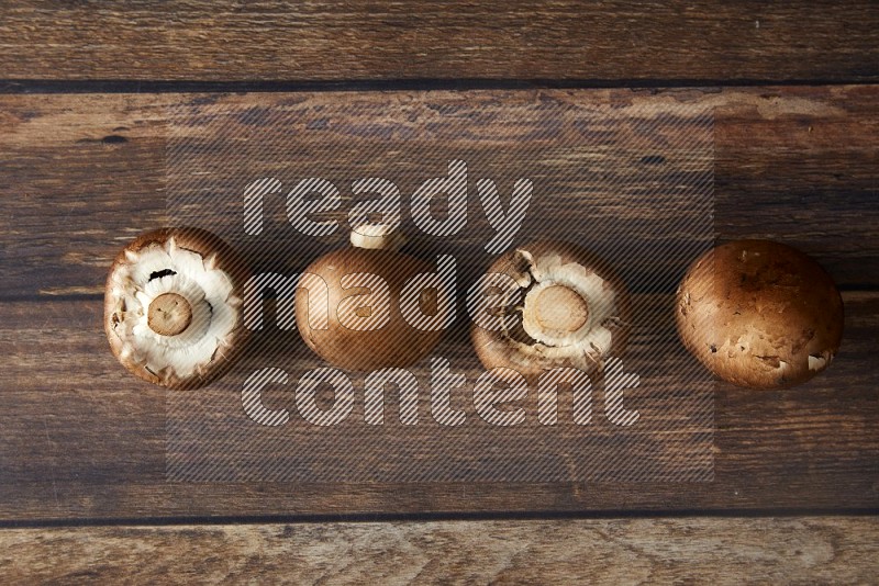 small fresh Cremini mushrooms topview  on wooden  background