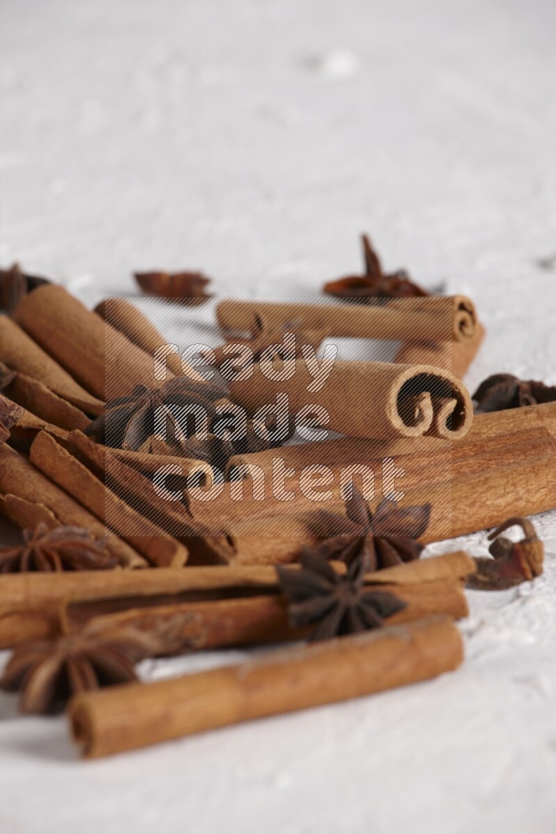 cinnamon sticks with star anise on white background