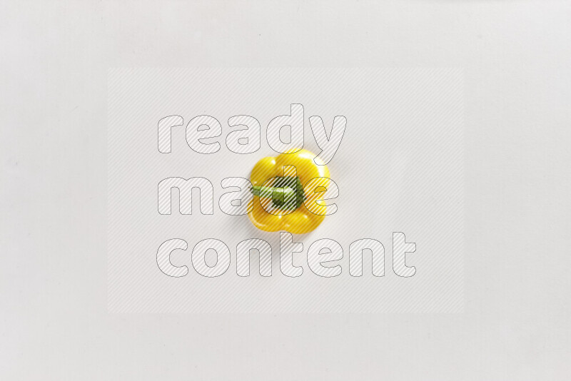 Yellow bell pepper slices on white background