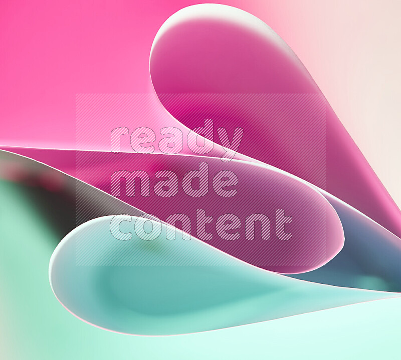 An abstract art of paper folded into smooth curves in green and pink gradients