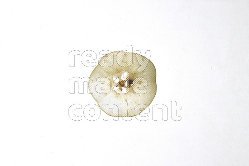 Pear slices on illuminated white background