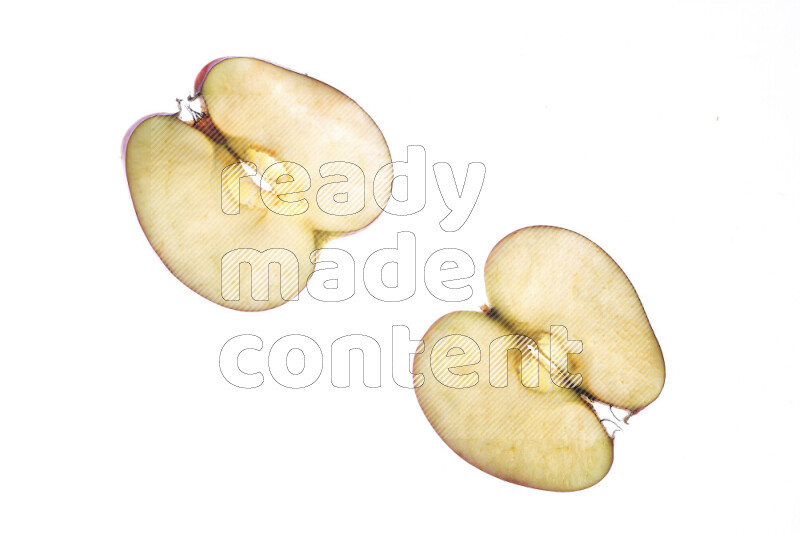 Apple slices on illuminated white background