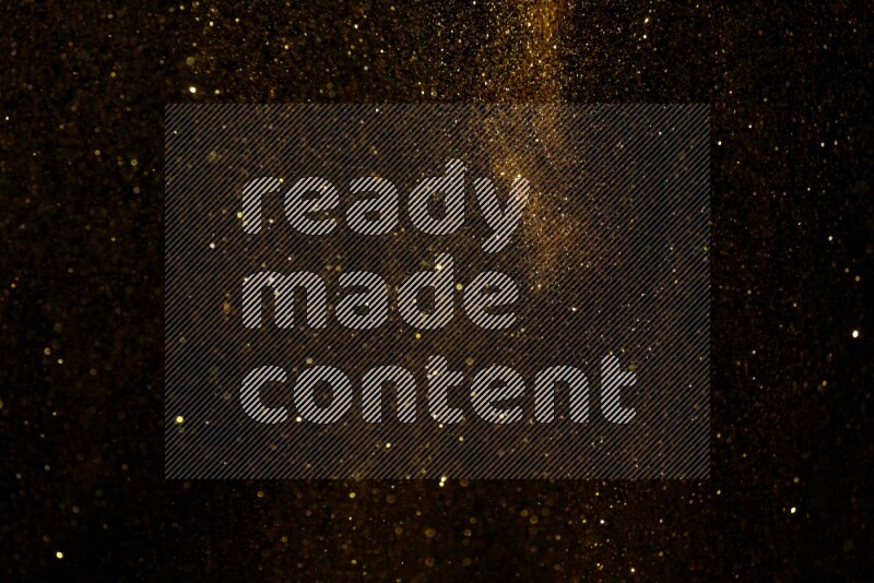 Gold glitter powder isolated on black background