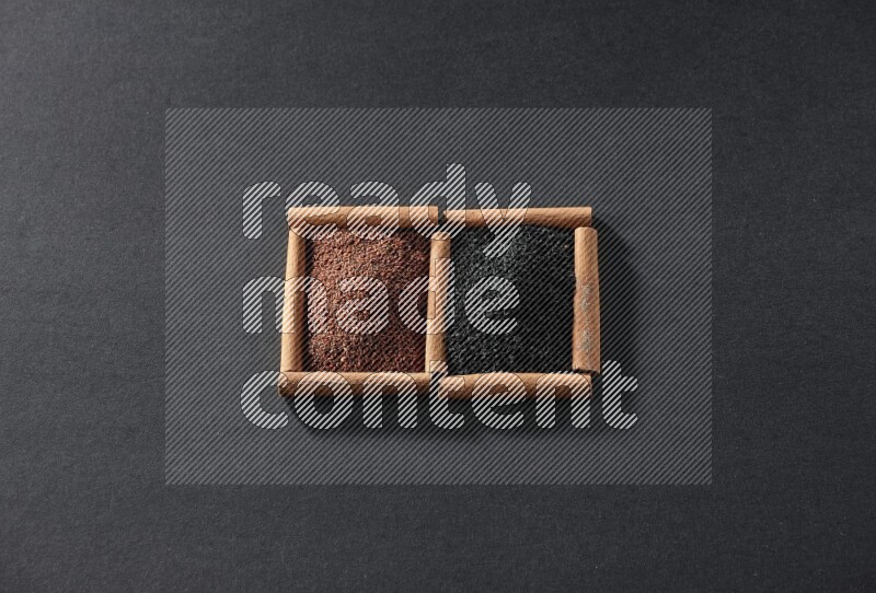 2 squares of cinnamon sticks full of garden cress and black seeds on black flooring