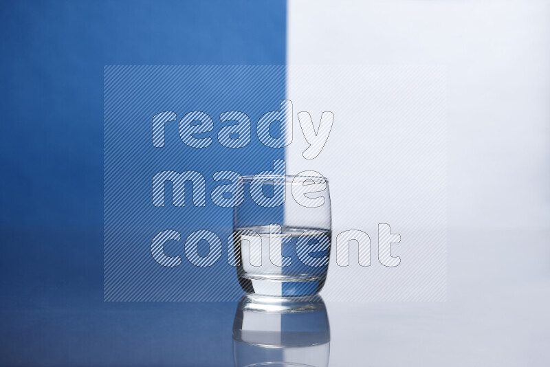 The image features a clear glassware filled with water, set against white and blue background