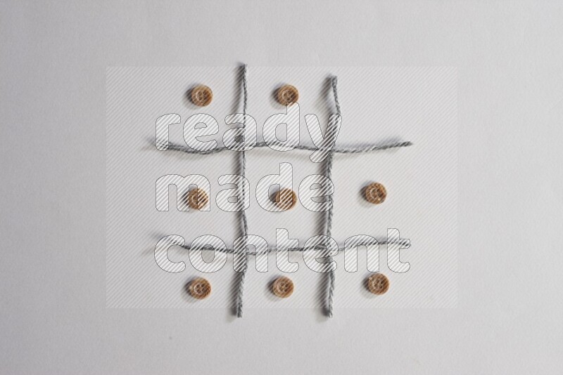 Brown buttons placed on grey background