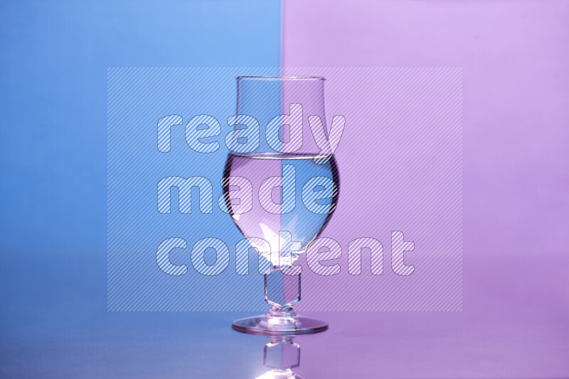 The image features a clear glassware filled with water, set against blue and light purple background