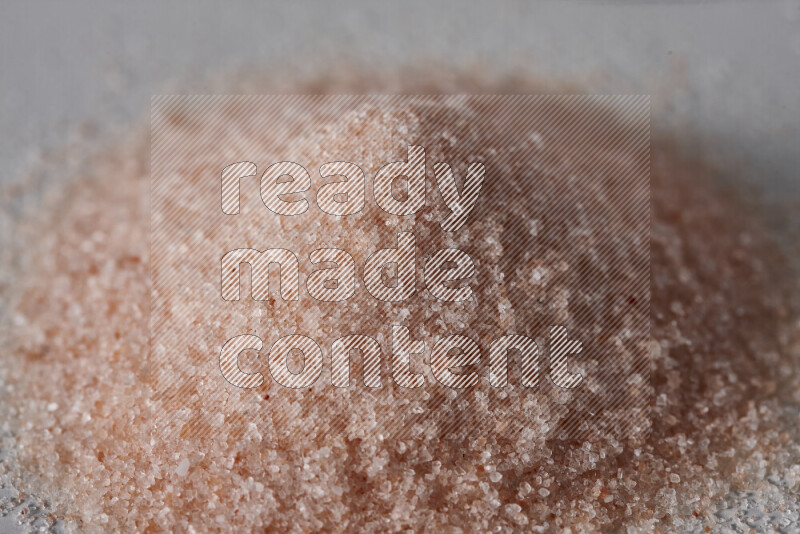 A bunch of fine himalayan salt on white background