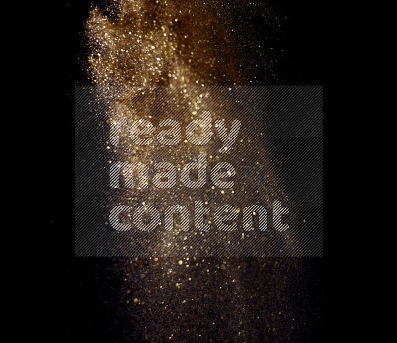 Gold glitter powder isolated on black background